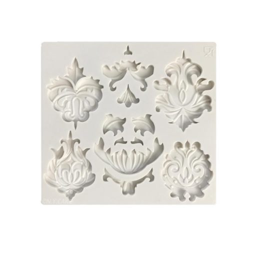 adorn cupcakes and cakes with this fancy molds. silicone base and available for purchase on create distribution