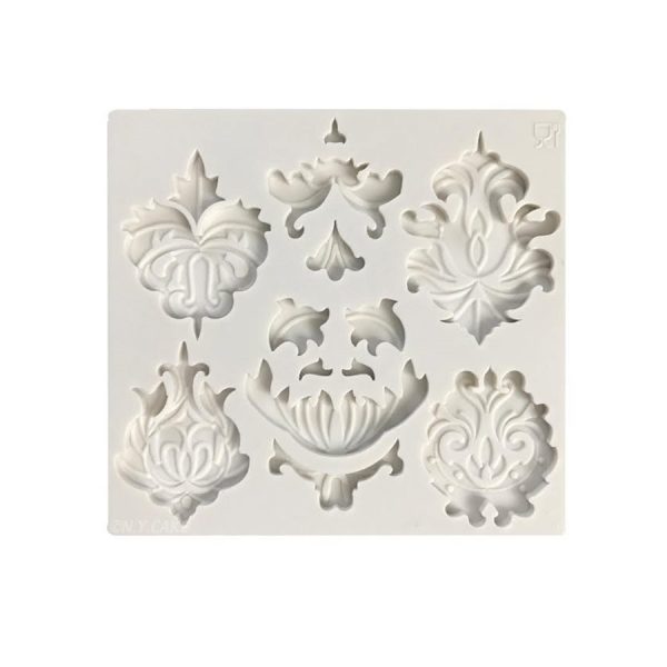adorn cupcakes and cakes with this fancy molds. silicone base and available for purchase on create distribution